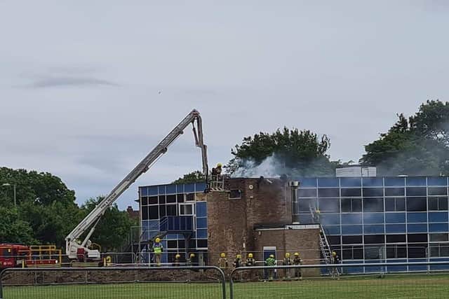 Firefighters pictured at Brune Park Community School fighting a blaze at one of the site's buildings. Photo: Simmone Prager