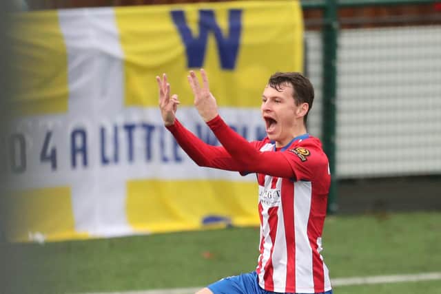 Dorking's Alfie Rutherford celebrates after completing his hat-trick. Picture: Dave Haines