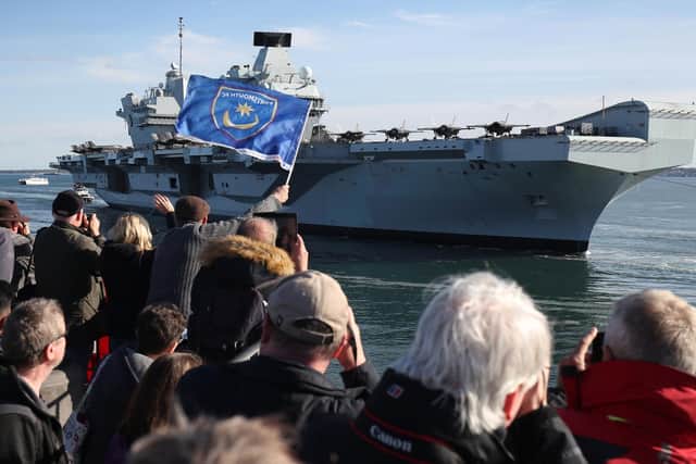 The Royal Navy aircraft carrier HMS Queen Elizabeth arrives back at Portsmouth Naval Base in Hampshire. Picture date: Wednesday May 19, 2021. PA Photo. Photo credit should read: Andrew Matthews/PA Wire