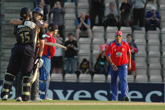 Michael Lumb celebrates with Michael Carberry after hitting Hampshire's first ever T20 century against Essex in June 2009. Picture: Rob Atkins