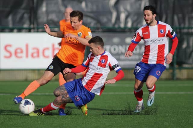 Wes Fogden is tackled during Hawks' win at Dorking in what turned out to be their last game. Picture: Kieron Louloudis