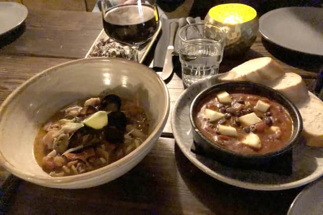 The fish stew dish and the baked halloumi with beans stew dish at Maya, Southsea