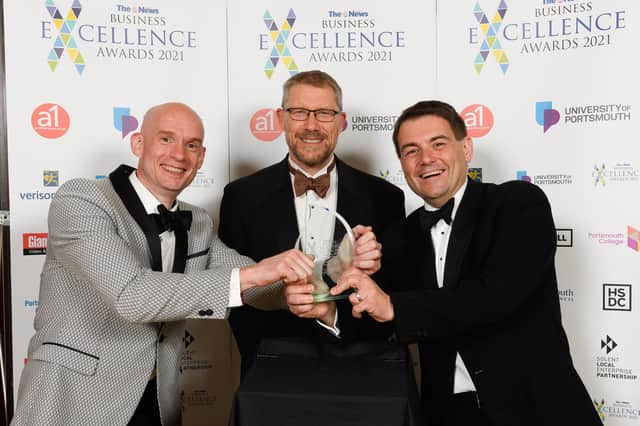Craig Gordon and Michael Frisby of Vuzion UK with editor of The News Mark Waldron at the Business Excellence Awards 2021