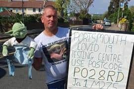 Adrian Ramsden, from Tipner Lane, with his sign directing people to the coronavirus testing facility. Picture: Supplied