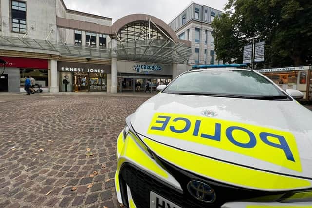 Police from the new city centre team parked outside Cascades in Commercial Road