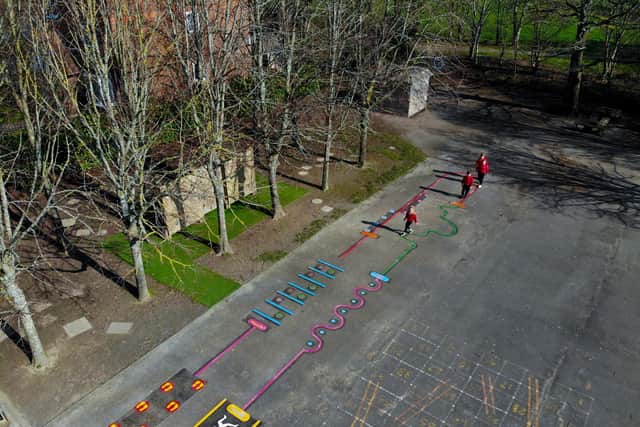 Keyworker children using the Active Playground trail after its installation at Elson Infant School.