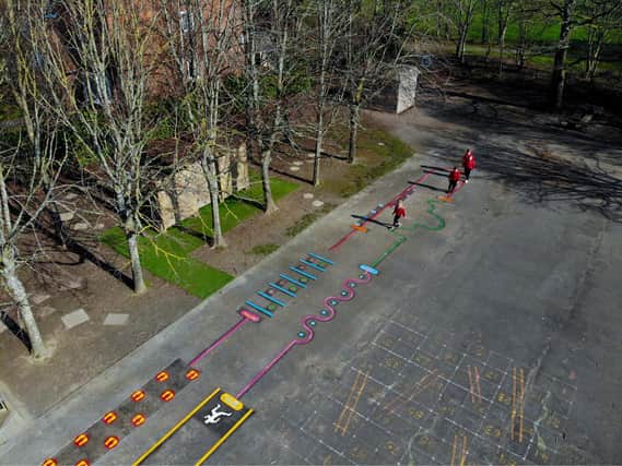 Keyworker children using the Active Playground trail after its installation at Elson Infant School.
