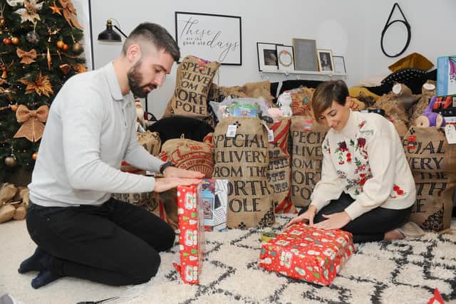 Sophie (28) and Dan Baker (30) from Waterlooville, started a group called PO Christmas present donation on Facebook in November, which has really taken off. Picture: Sarah Standing (101220-98)