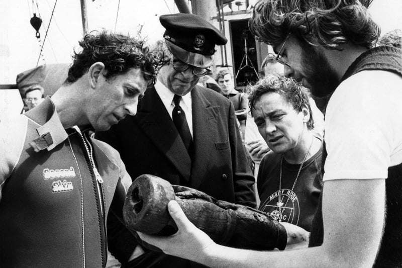 Prince Charles inspecting a metal powder cask, one of the items recovered recently from the Mary Rose in 1980.