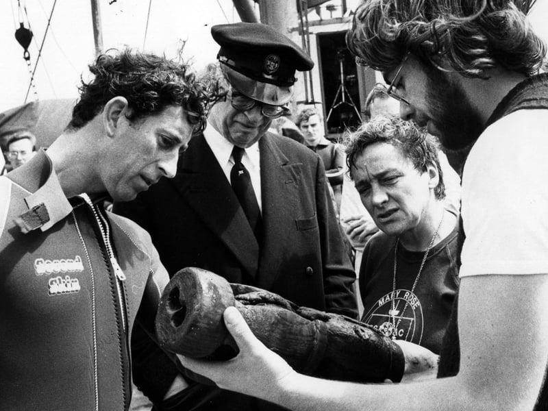 Prince Charles inspecting a metal powder cask, one of the items recovered recently from the Mary Rose in 1980.