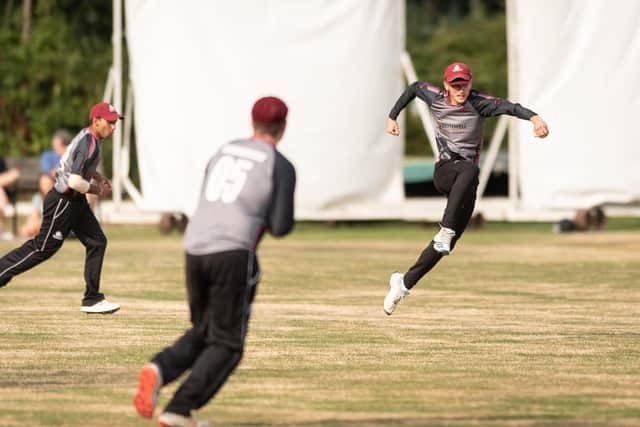 Portsmouth & Southsea captain Ben Saunders leaps for joy after taking an early catch in Fair Oak's reply. Picture: Keith Woodland