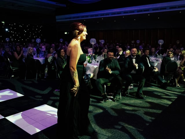Lulu Whitmore makes her way to the stage after being announced as the winner of Outstanding Contribution to Business. Picture: Keith Woodland (270321-321)