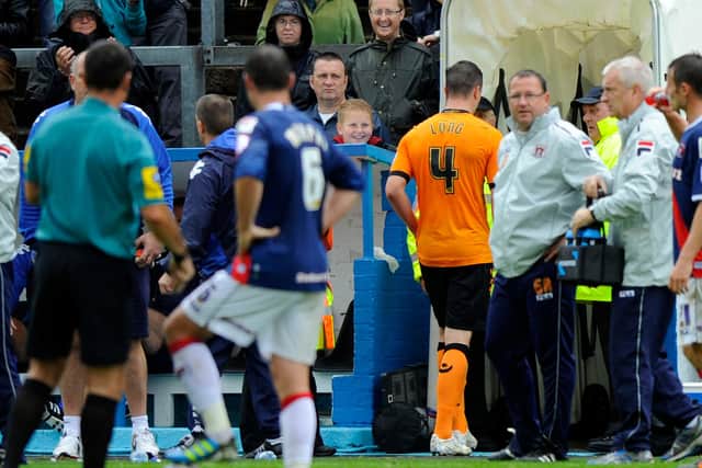 Kevin Long (in orange) was sent off for Pompey in a march at Carlisle in August 2012. Picture: Allan Hutchings