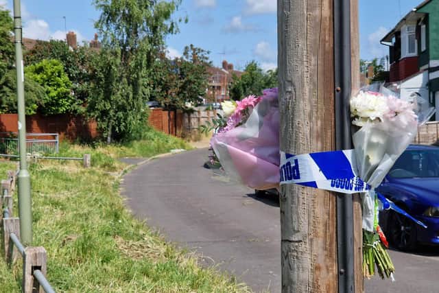 Flowers and heartfelt notes have been placed in Chalton Crescent to pay tribute to Barry Cairns.