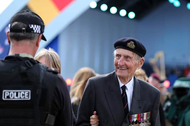 Commando Jim Booth, 97, enjoys a chat with the police. D-Day 75 National Commemorative Event, Southsea Common, Portsmouth.                    Picture: Chris Moorhouse           (050619-54)    