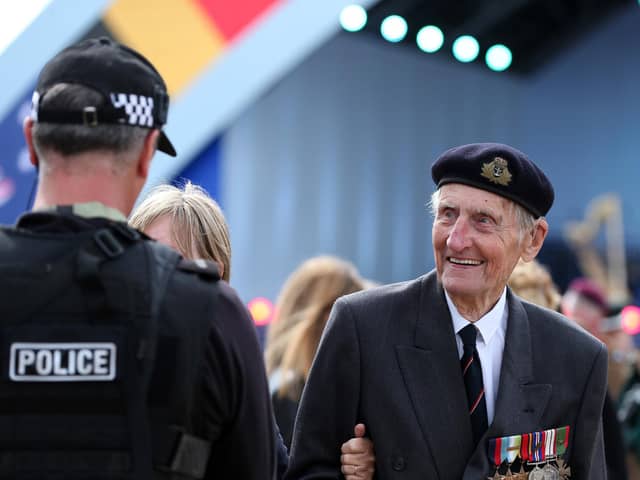 Commando Jim Booth, 97, enjoys a chat with the police. D-Day 75 National Commemorative Event, Southsea Common, Portsmouth.                    Picture: Chris Moorhouse           (050619-54)    