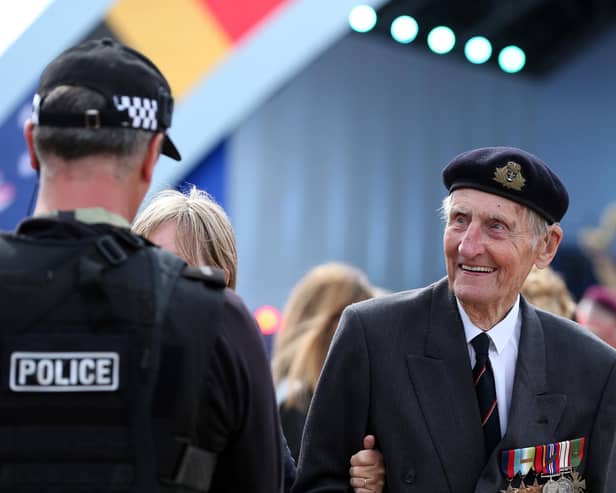 Commando Jim Booth, 97, enjoys a chat with the police. D-Day 75 National Commemorative Event, Southsea Common, Portsmouth.                    Picture: Chris Moorhouse           (050619-54)    