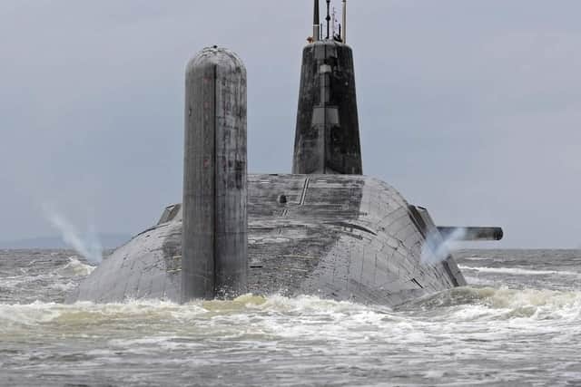 Pictured is HMS Vanguard as it 'vents off' as she leaves HMNB Clyde (Faslane).