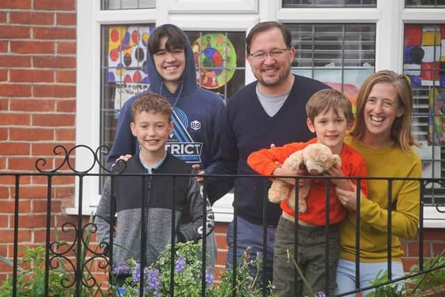 Photographer Sophia Benham from North End has been capturing images of families during lockdown as part of her #atourfrontdoor project to raise money for domestic abuse charity Aurora New Dawn. Pictured: An example of one of the families on their doorstep