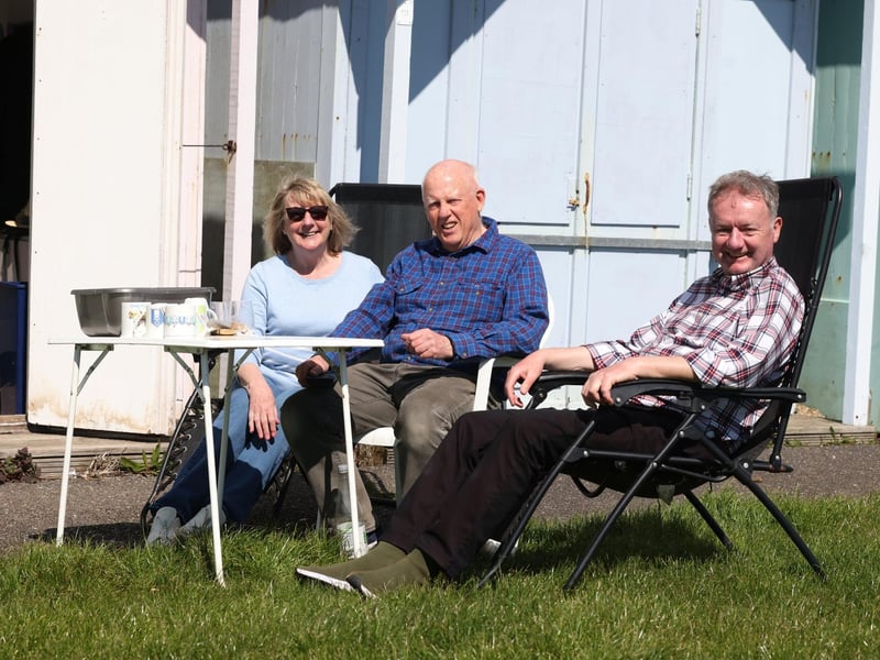 Teresa Jeffery, Chris Cheetham and Richard Jeffery by their beach huts