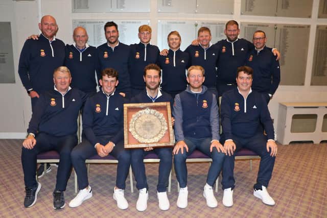 The Hampshire team ans support staff wtih the Daily Telegraph Salver after they beat Essex 7.5-4.5 in the South East League Final at Northwood Golf Club. Back (from left) Chris Harrison (Hampshire Golf assistant secretary), Kevin Flynn (head coach), Martin Young, James Freeman, Jo Hacker, Ryan Henley, Sam Parsons (reserve), Simon Andrews (assistant coach). Front: Richard Arnold (county secretary), Rob Wheeler, Toby Burden (capt), George Saunders, Tom Robson. Picture: Andrew Griffin