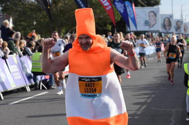 Great South Run - Southsea Action

Pictured is: Andy Card, the traffic cone completes the 10-mile race

Picture: Keith Woodland (171021-0)