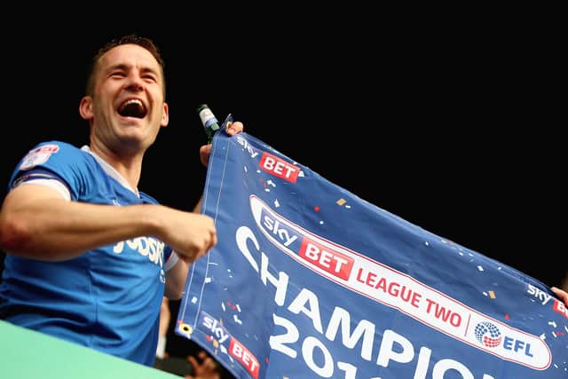 Michael Doyle celebrates Pompey's 2016-17 League Two title win Picture: Harry Murphy/Getty Images