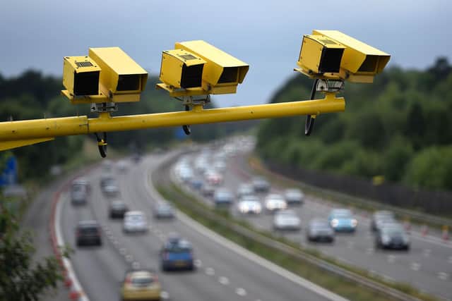 Three SPECS Average Speed cameras in position on the M3 motorway in Hampshire. Photo: Andrew Matthews/PA Wire