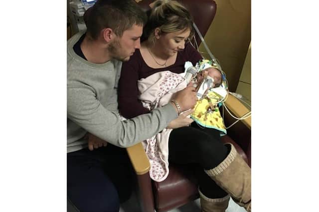 Ryan and Josie Granger with River when she was born