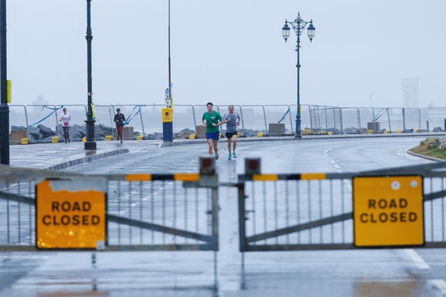 Runners hit the streets in wet and windy conditions despite The Great South Run being cancelled.