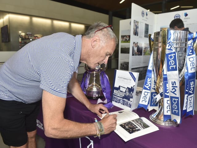 The 125 years celebrating Portsmouth FC in photographs exhibition is on show at Ravelin Sports Centre in Portsmouth and will be on display until Sunday, August 18, 2024.
Pictured is: Photographer Stuart Roy Clarke signing copies of the book.
Picture: Sarah Standing (050824-8986)