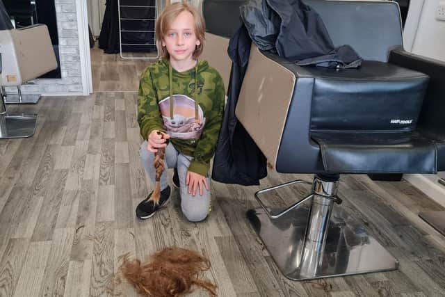 The youngster with the plait.