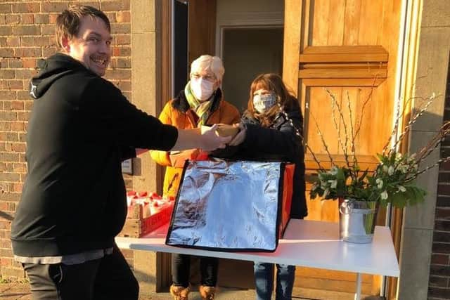 St M's Events in Paulsgrove has been handing out free meatballs to the community on Meatball Mondays. Pictured: Volunteers Maureen Levesque And Shirley Hobbs handing food to a happy customer