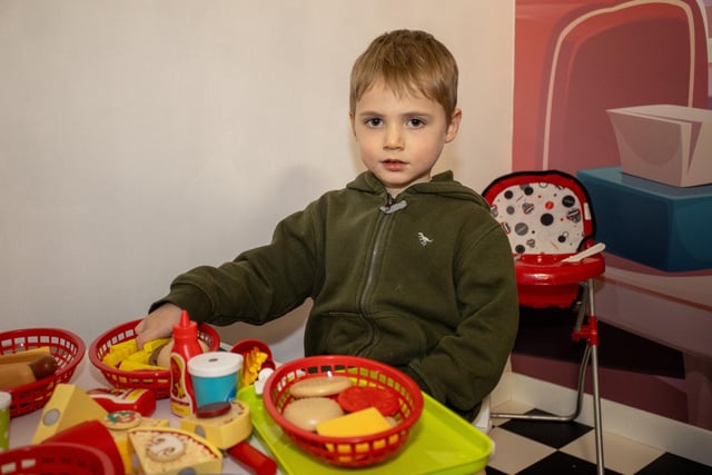 Callum, 4, gets stuck in to the food at the diner in Mini Town Role Play & Cafe in Waterlooville. Photos by Alex Shute