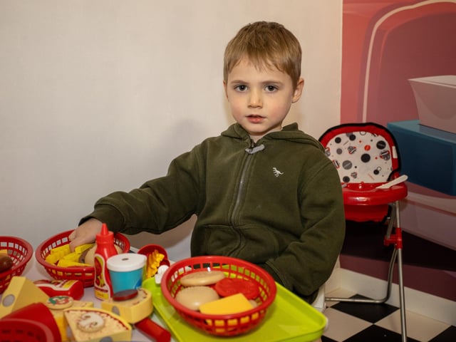 Callum, 4, gets stuck in to the food at the diner in Mini Town Role Play & Cafe in Waterlooville. Photos by Alex Shute