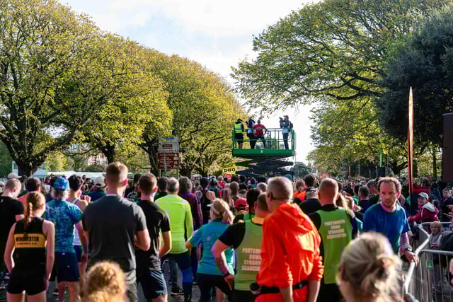 The crowds warm up before starting the run.