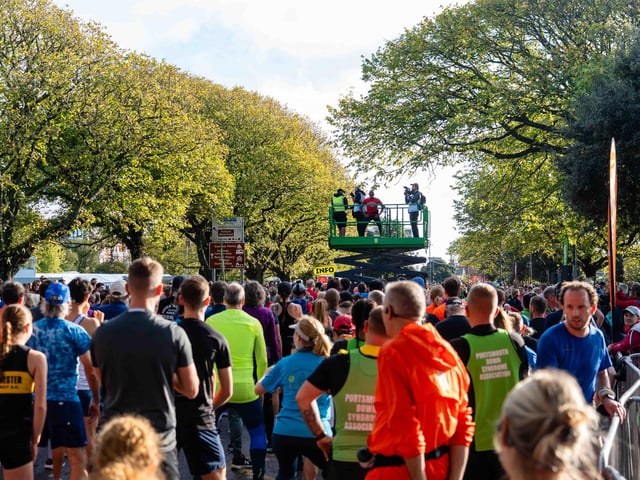 The crowds warm up before starting the run.