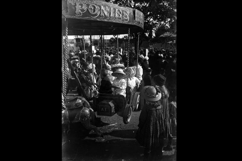 circa 1900:  Children riding on the carousel at Southsea fairground.  (Photo by Hulton Archive/Getty Images)