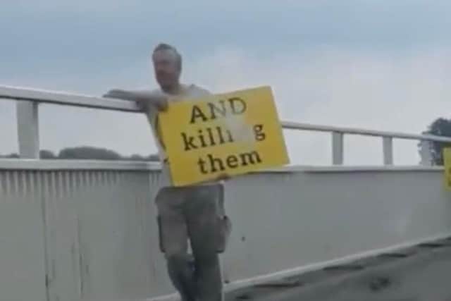 Protesters staged a bizarre anti-vaccine rally on a bridge into Hayling Island on Sunday.