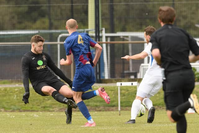 Liam Ferdinand rounds Tom Price prior to levelling in the 80th minute for Binfield. Picture: Keith Woodland