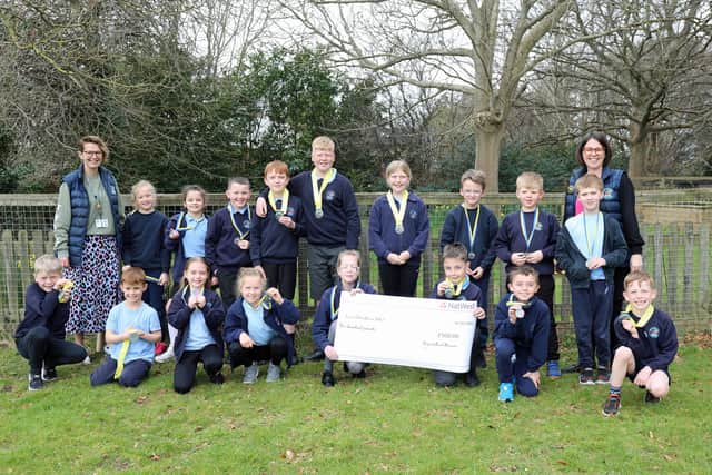 Lee-on-the-Solent Junior School and participants from Years 3, 4 and 6 with their prize.