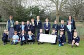 Lee-on-the-Solent Junior School and participants from Years 3, 4 and 6 with their prize.