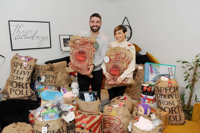 Sophie (28) and Dan Baker (30) from Waterlooville, started a group called PO Christmas present donation on Facebook in November, which has really taken off. Picture: Sarah Standing (101220-74)
