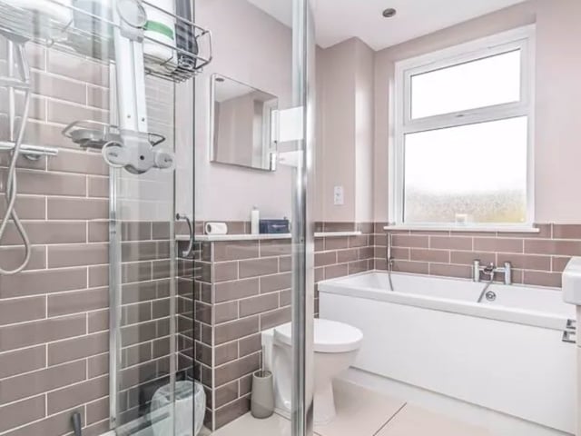 The listing says: "This excellently presented, extended end-of-terrace property has accommodation set over three inviting floors, with three bedrooms and a separate study room, making it an ideal family home."