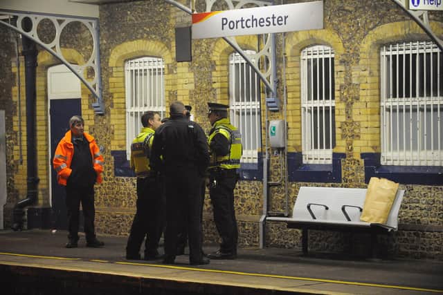 A man has died after being hit by a train at Portchester railway station. Pictured is a library photo of British Transport Police attending an incident at the railway station.
Photo: MALCOLM WELLS (090806-6196)