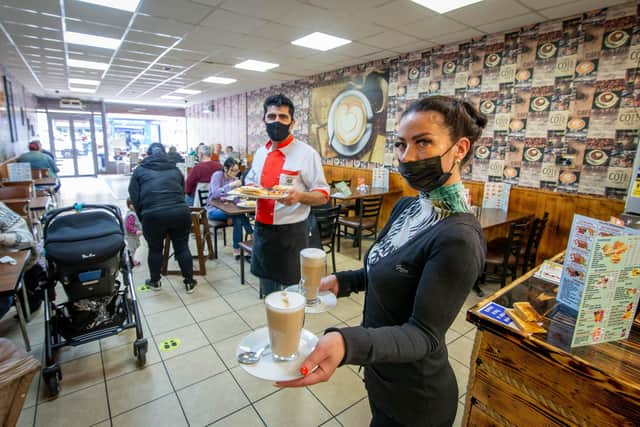 Staff Shagl Osman and manager Khaled Sleman excited to serve indoors in cafe Nut, North End, Portsmouth. Picture: Habibur Rahman