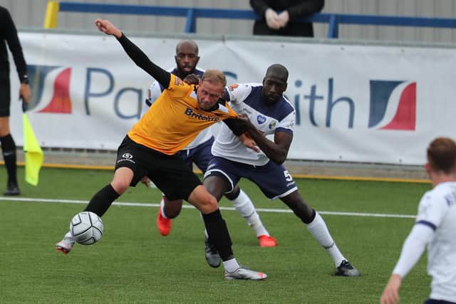 Moussa Diarra, on his competitive debut for Hawks, tussles with Scott Rendell. Picture by Dave Haines.