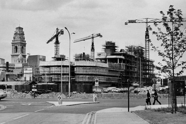 Portsmouth Guildhall almost lost by the mass of concrete buildings under construction around it, 12th June 1974