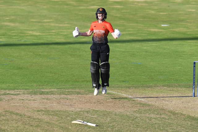 Emily Windsor of Southern Vipers celebrates hitting the winning run during the Rachael Heyhoe-Flint Trophy final. Photo by Tony Marshall/Getty Images.