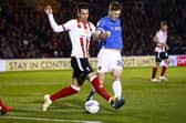 Sean Raggett must serve a one-match ban following his booking at Lincoln. Picture: Daniel Chesterton/phcimages.com